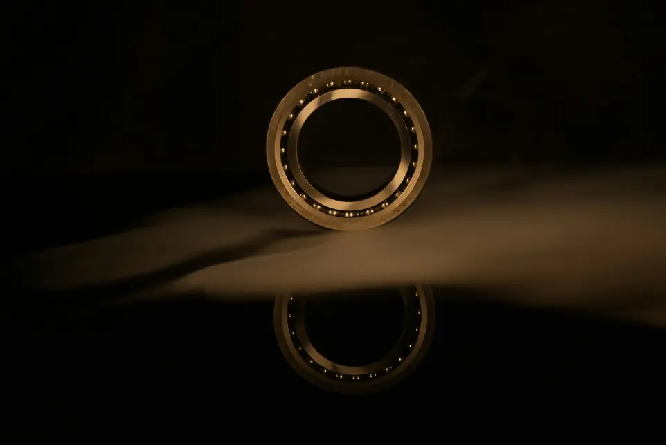 A ball bearing bearing on a black surface